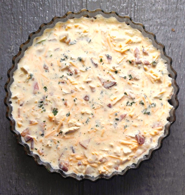 chicken quiche in a quiche dish Crustless chicken quiche ready to cook