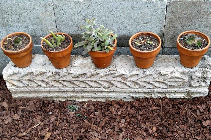 Decorative cement rectangle added to the raised planter