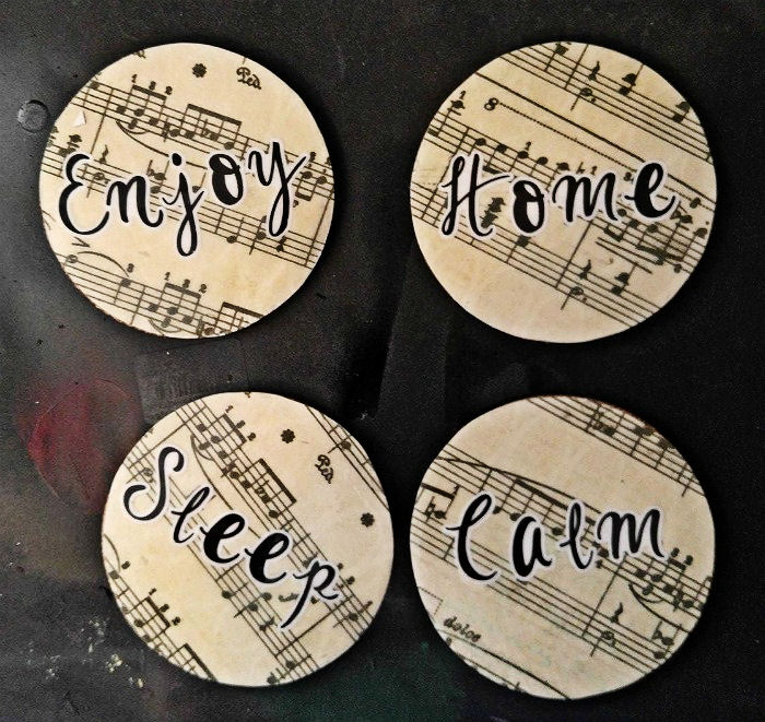 Apply spray varnish to the coasters.