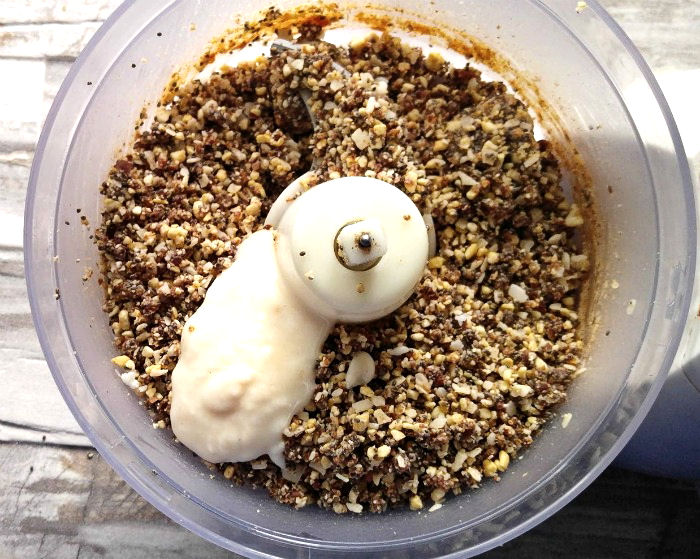 adding coconut butter to the energy bite mixture