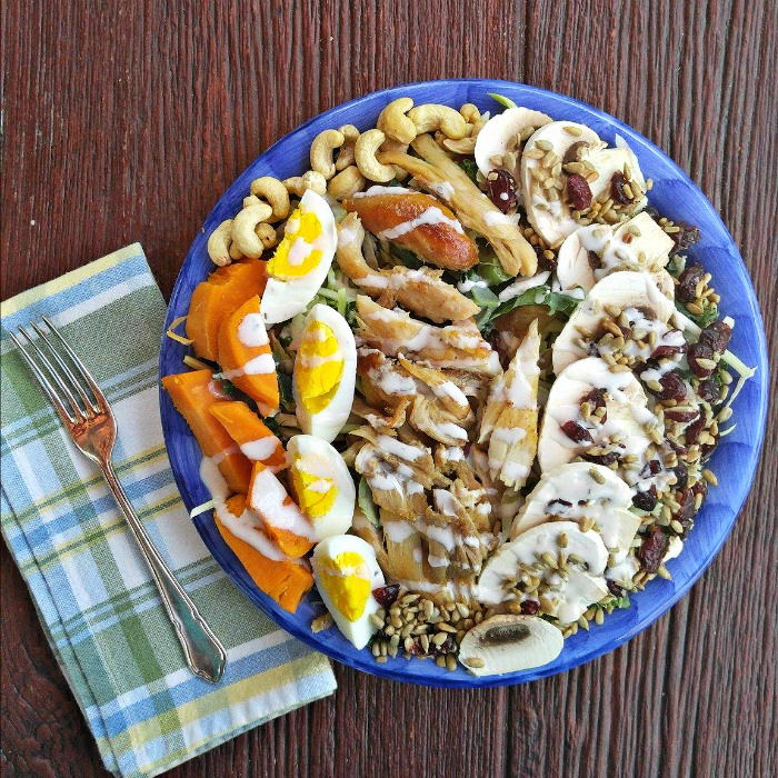 chicken salad with sunflower seeds, yams and kale