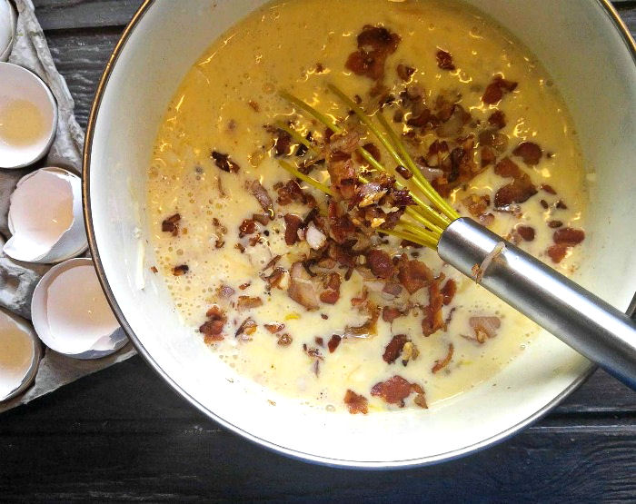 Add bacon to eggs Add bacon mixture to eggs