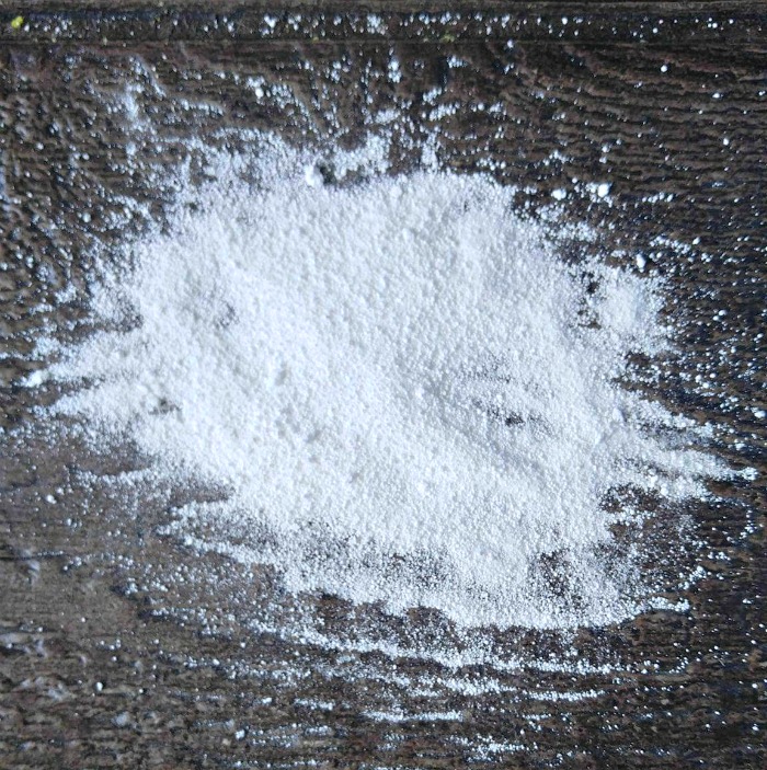 Borax powder on a wooden board.