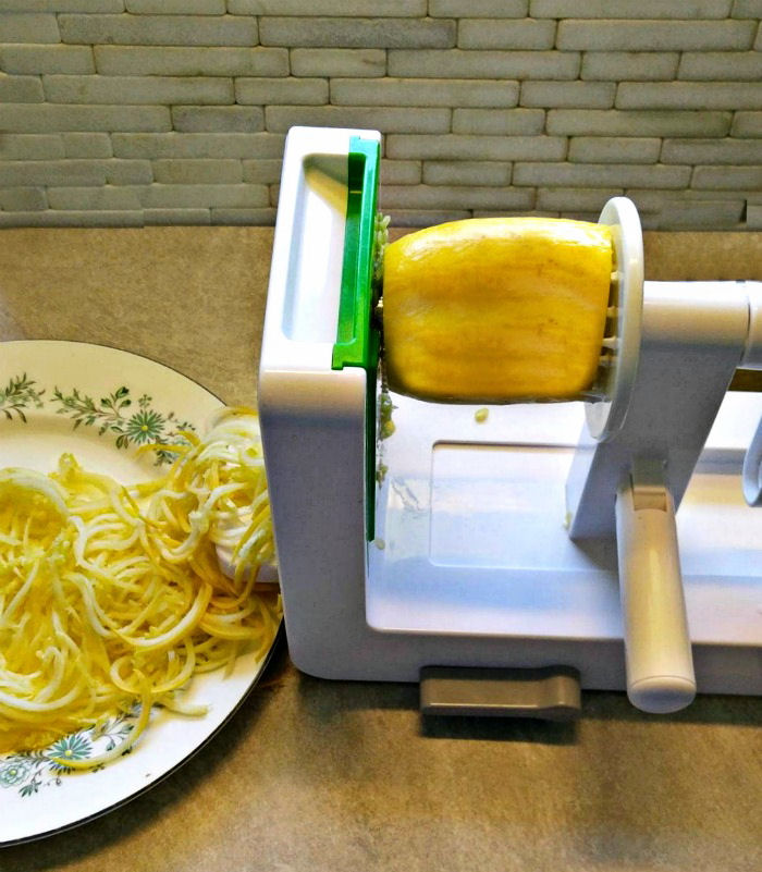 Spiralizing yellow zucchini into noodles
