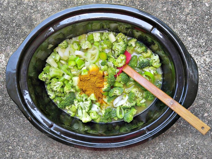 Adding the spices to the soup