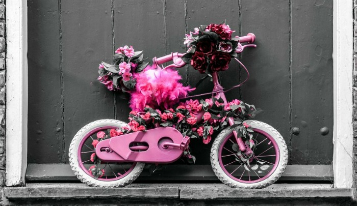 pink and white child's bicycle planter Pink and white child's bicycle planter