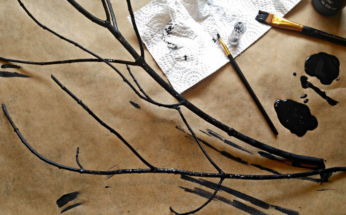 Adding glitter to tree branches