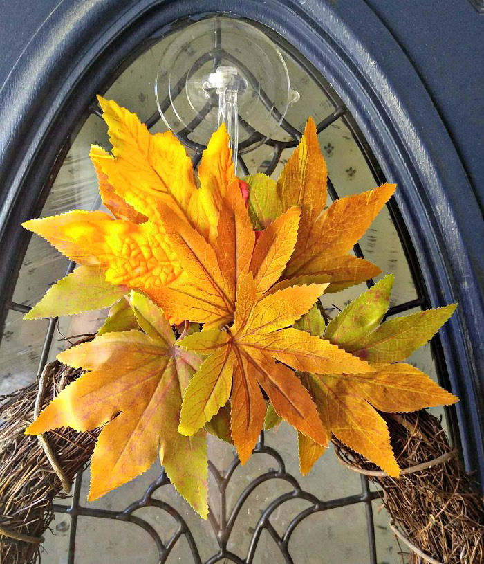 Autumn leaves above the wreath