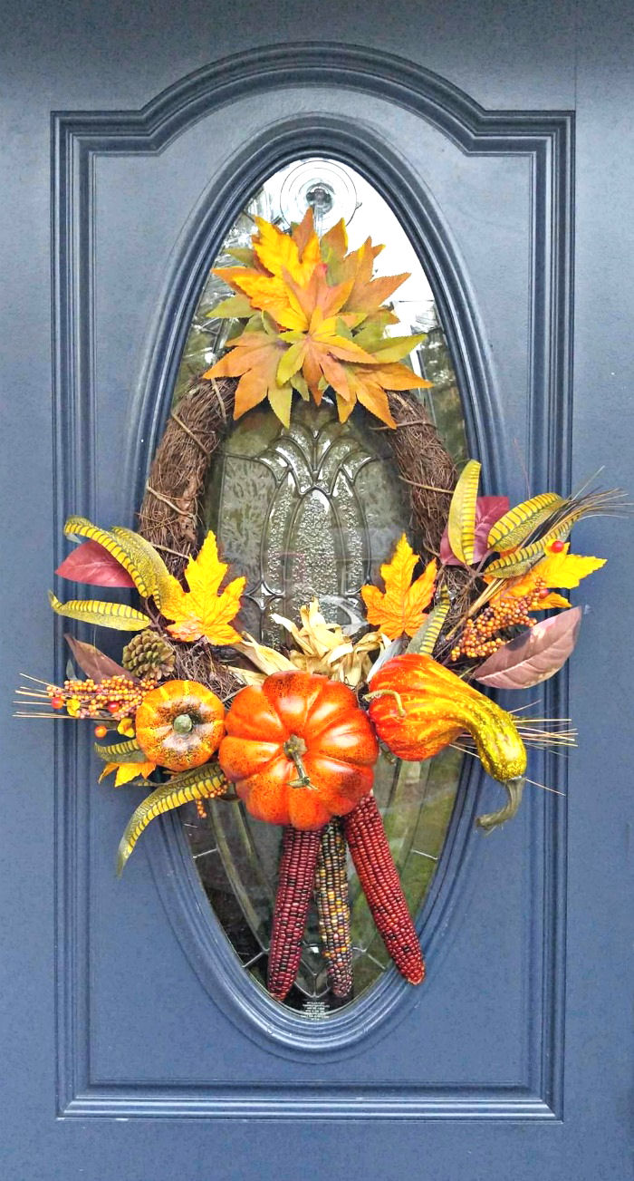 Thanksgiving wreath with Indian corn and autumn leaves