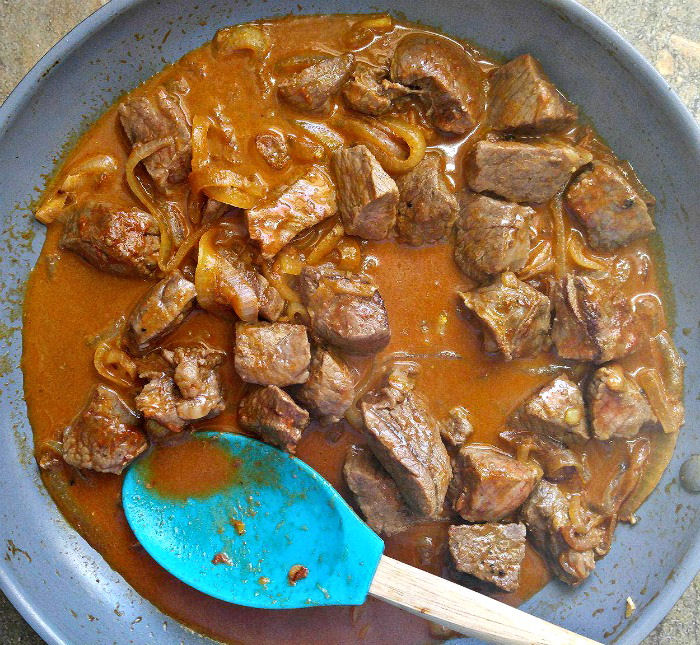 Beef curry with a red sauce