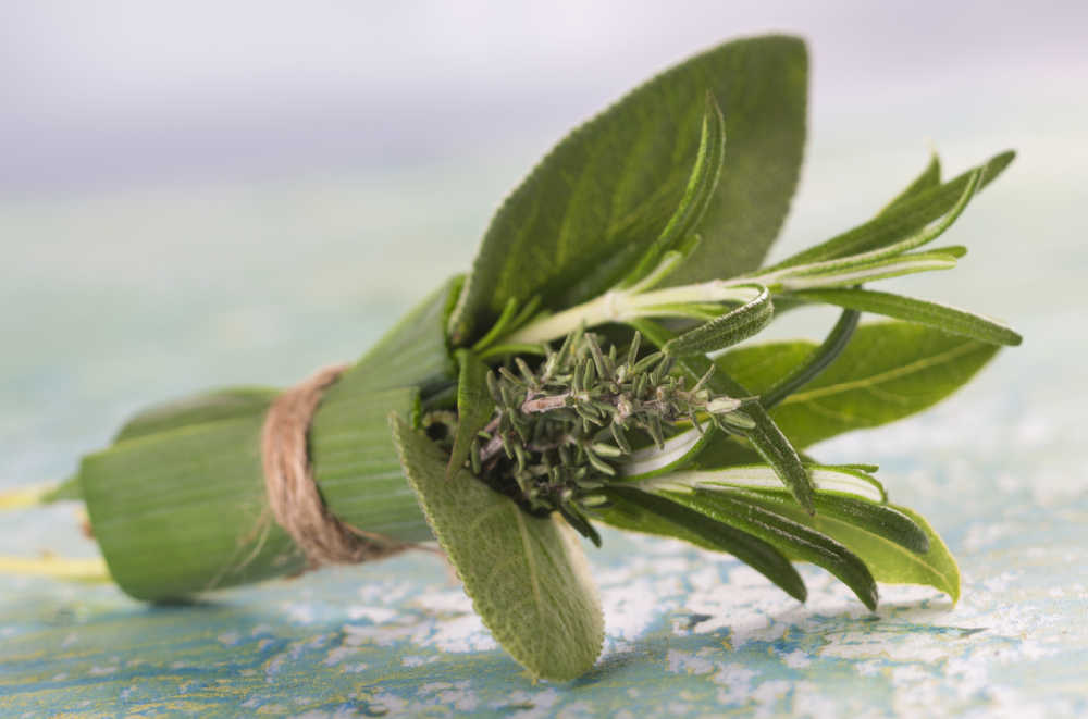 Herbs in a bouquet tied with twine - known as a bouquet garni.