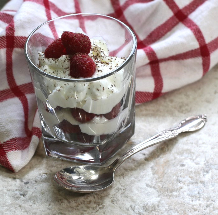 Greek yogurt parfait with raspberries and grated dark chocolate