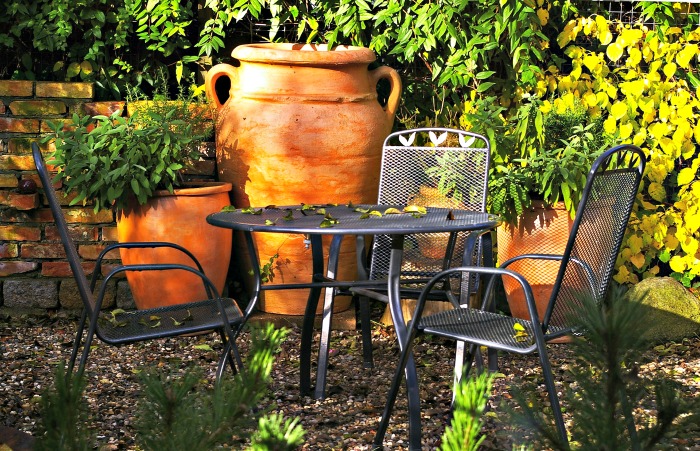 Terracotta pots and metal tables