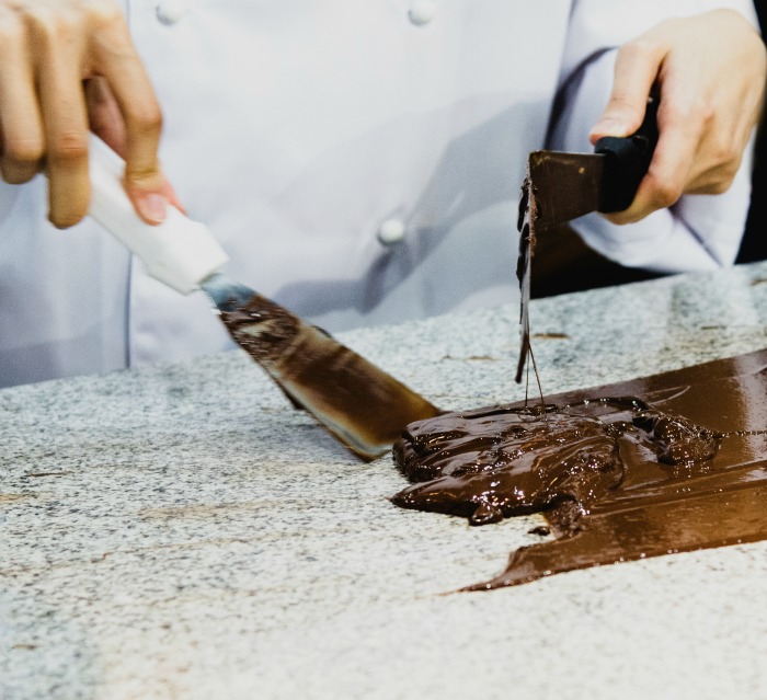Making fudge on a marble slab.