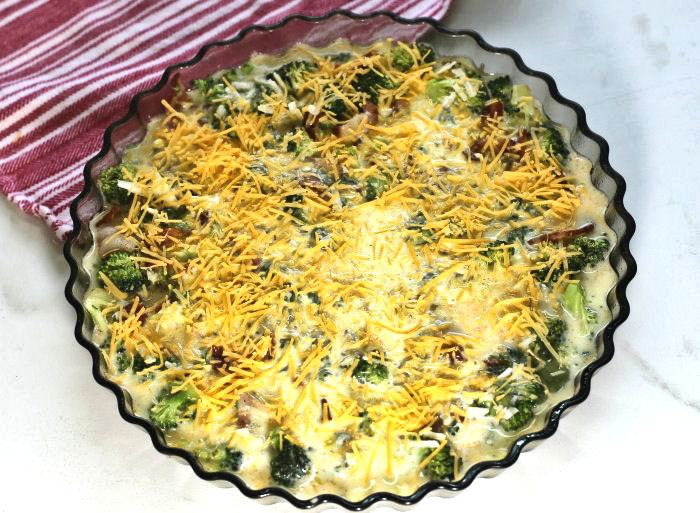 eggs and cheese over broccoli and bacon