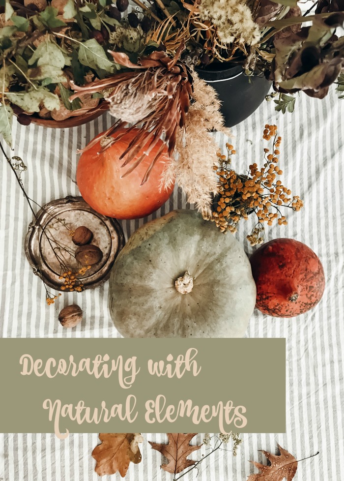 Fall greenery arrangement with words "Decorating with natural elements."