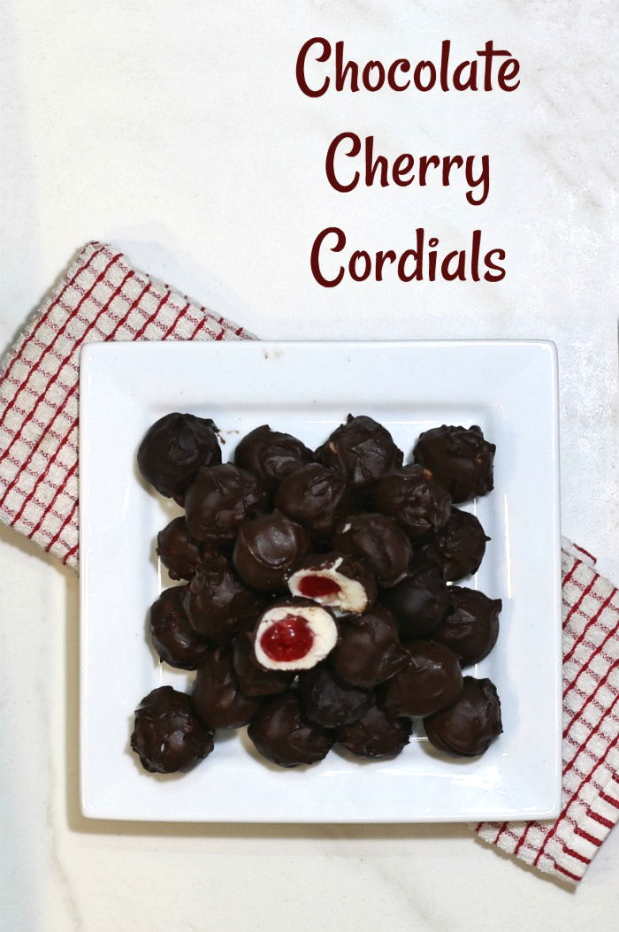 Chocolate cherry cordials on a white plate