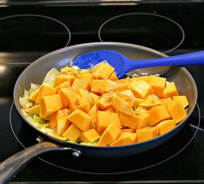 leeks and squash in a frying pan