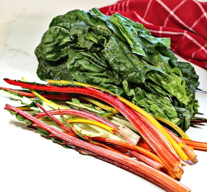 Cutting away Swiss chard leaves from the stems