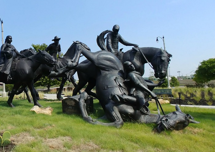 bronze statue of a fallen horse