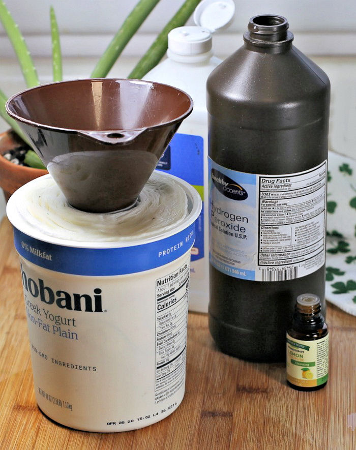 Funnel in a Chobani container with paper towels.