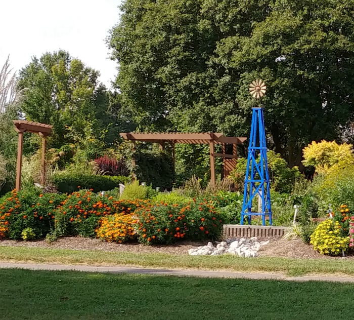 Weather Vane, pergolas and a garden bed at Springfield Botanical Gardens