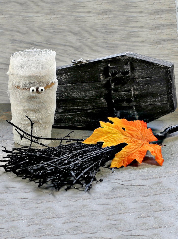 Mummy glass with coffin, leaf and witch broom.