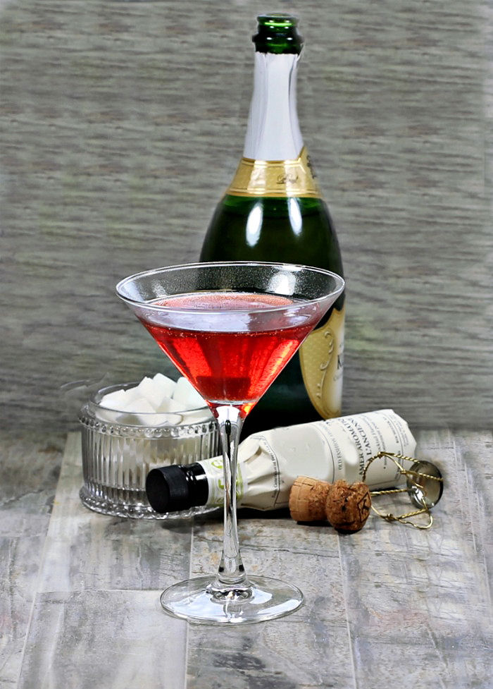 Making a crow's blood Halloween drink - version of a champagne cocktail.