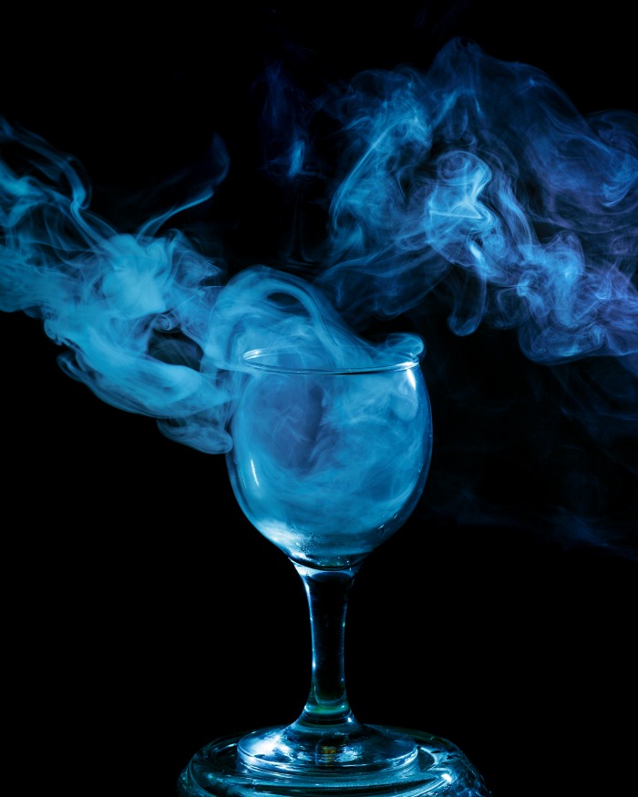 Drink with tonic water lit by a black light to turn blue.