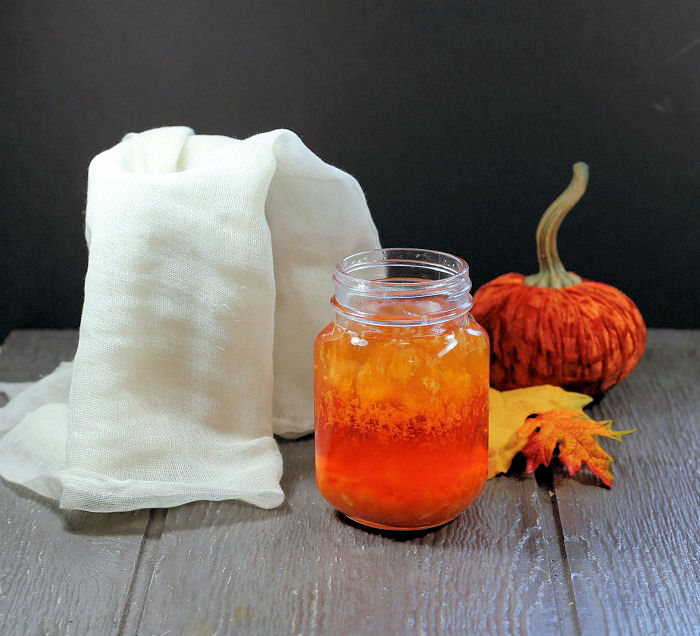 Straining candy corn vodka.