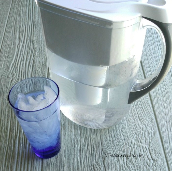 Brita filtered water picture and glass of water helps to saves on plastic use to protect the environment.
