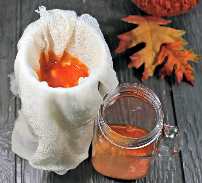 Straining candy corn vodka.
