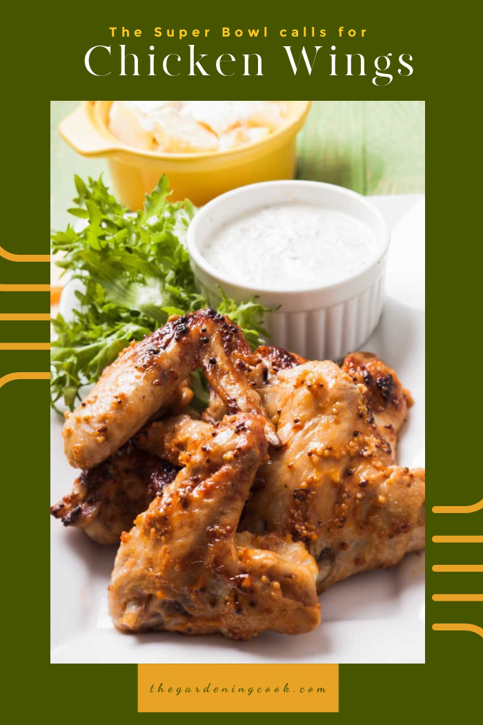 Chicken wings on a plate with words reawding "The Super Bowl calls for Chicken wings.