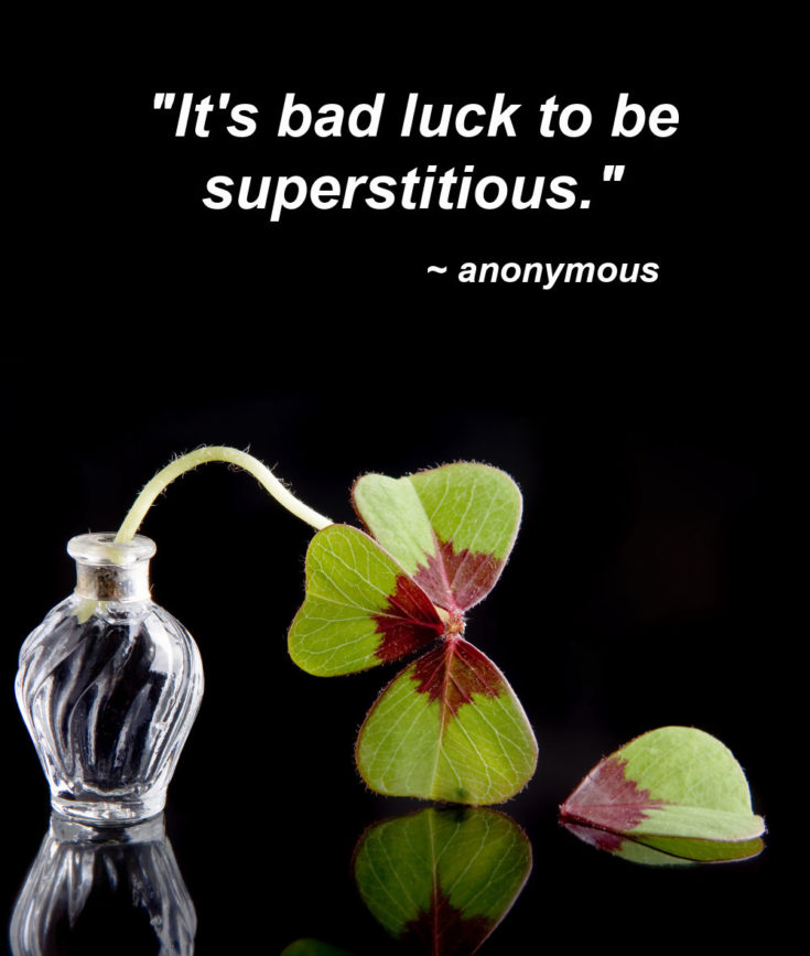 Broken oxalis shamrock plant with text reading "it's bad luck to be superstitious."
