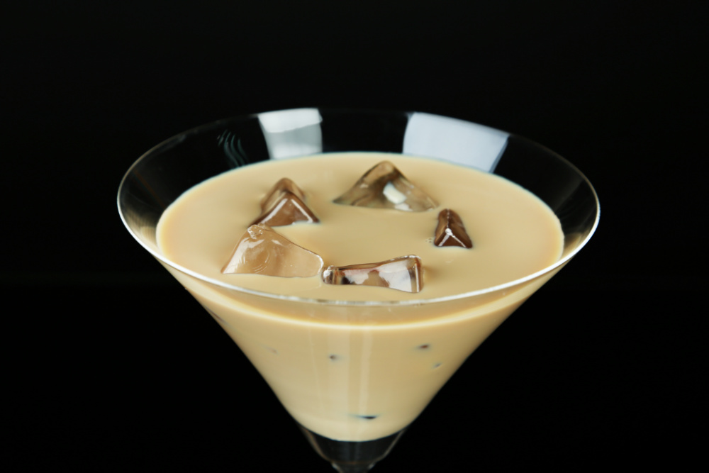 Glass of Bailey's Irish cream in a martini glass with ice.