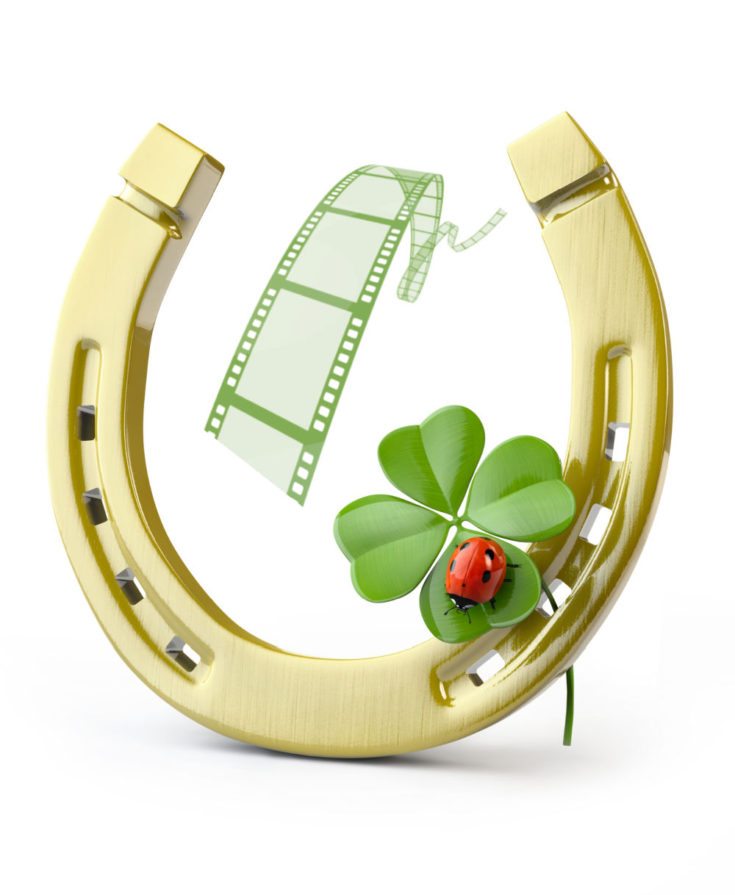 Shamrock and ladybug with horseshoe and move reel.