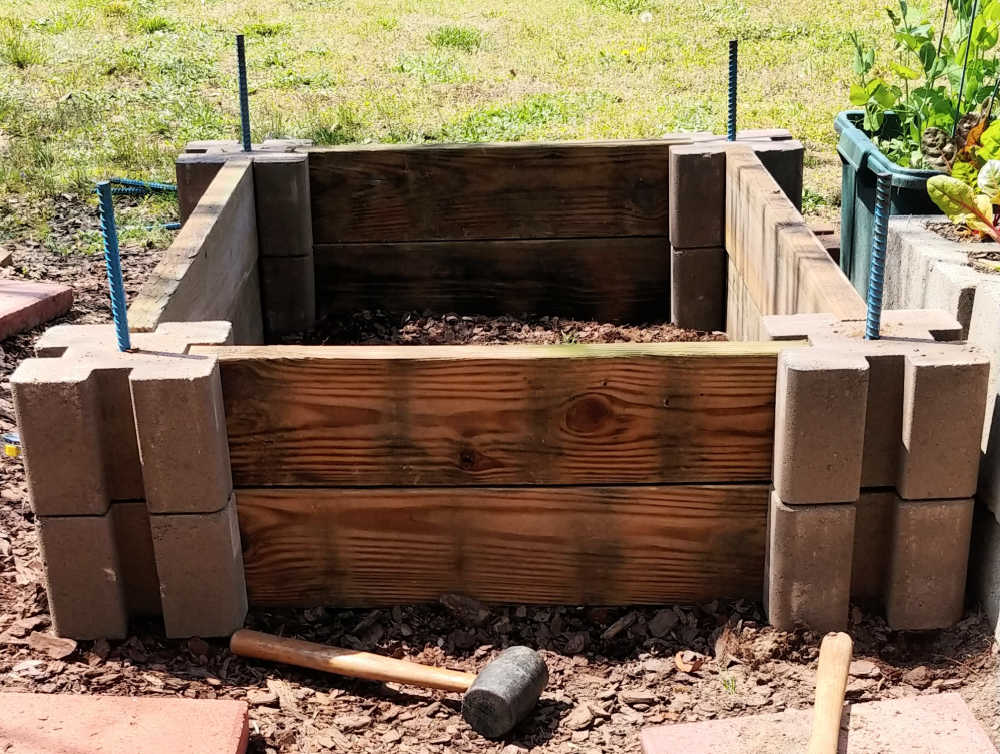 Rebar into the end of concrete block supports and rubber mallet.