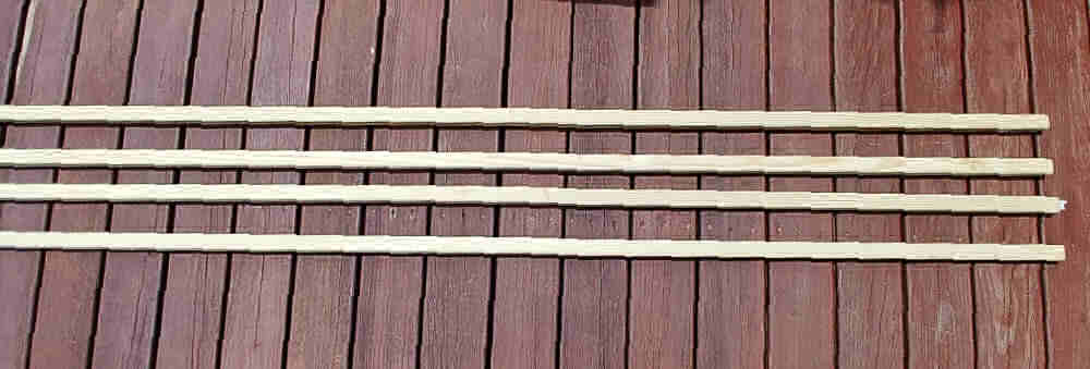2 by 2 pieces of wood on a stained deck.