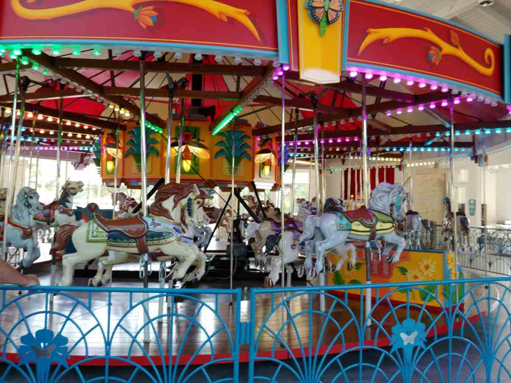 Joyland carousel with colorful horses.