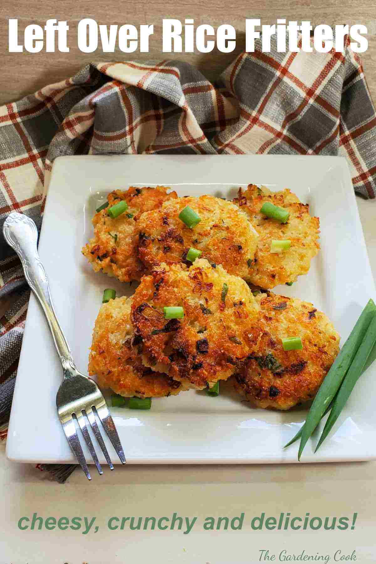 Rice patties on a plate with fork and spring onions and words Left Over Rice Fritters.